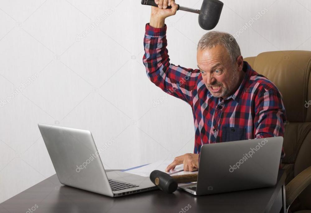 depositphotos_87344148-stock-photo-angry-man-crashing-laptop.jpg